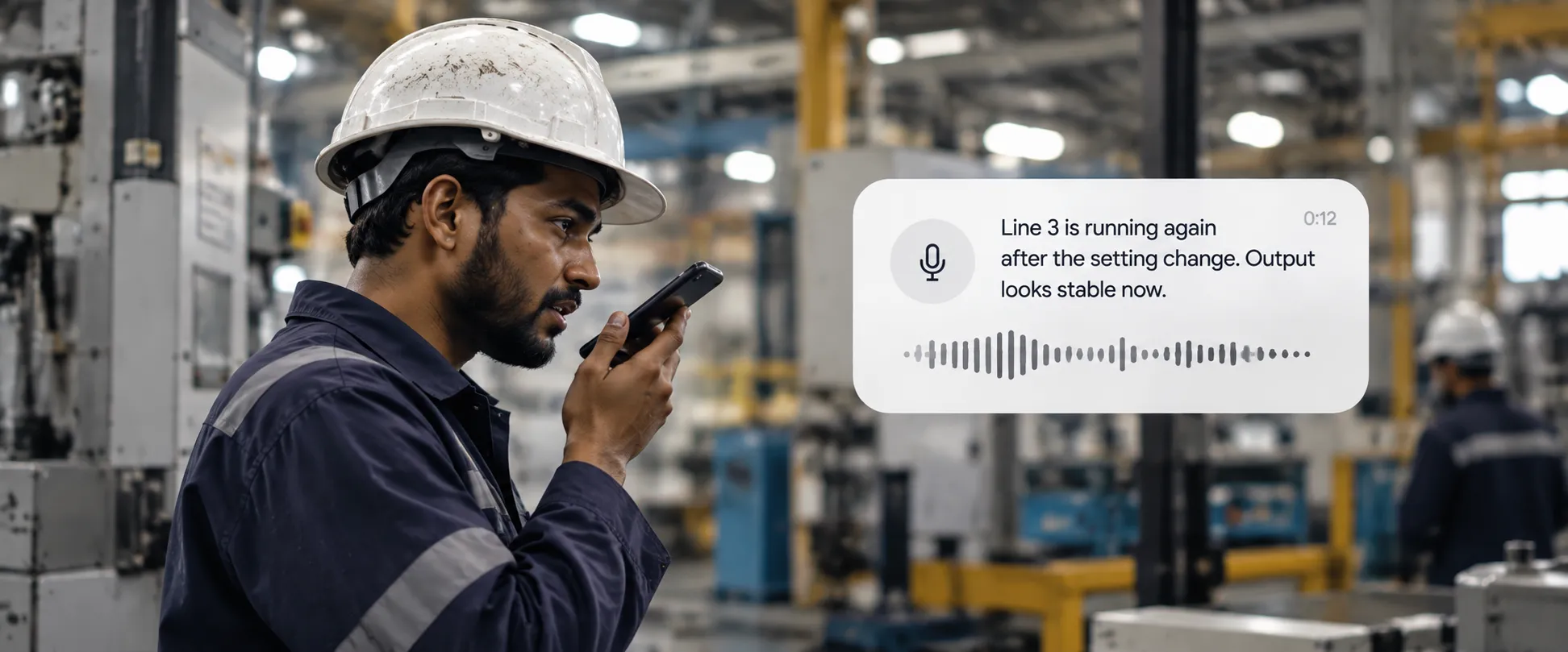 A factory worker speaking a status update into his phone, with a live transcript of what he's saying shown beside him.